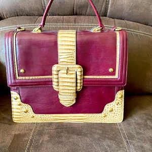 Authentic burgundy Brahmin bag with strap. Perfect for fall!